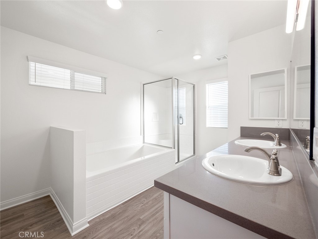 1325 West Grand Avenue, Unit 3 Pomona, CA 91766 - Photo 18 of 30 a bathroom with a sink and a mirror