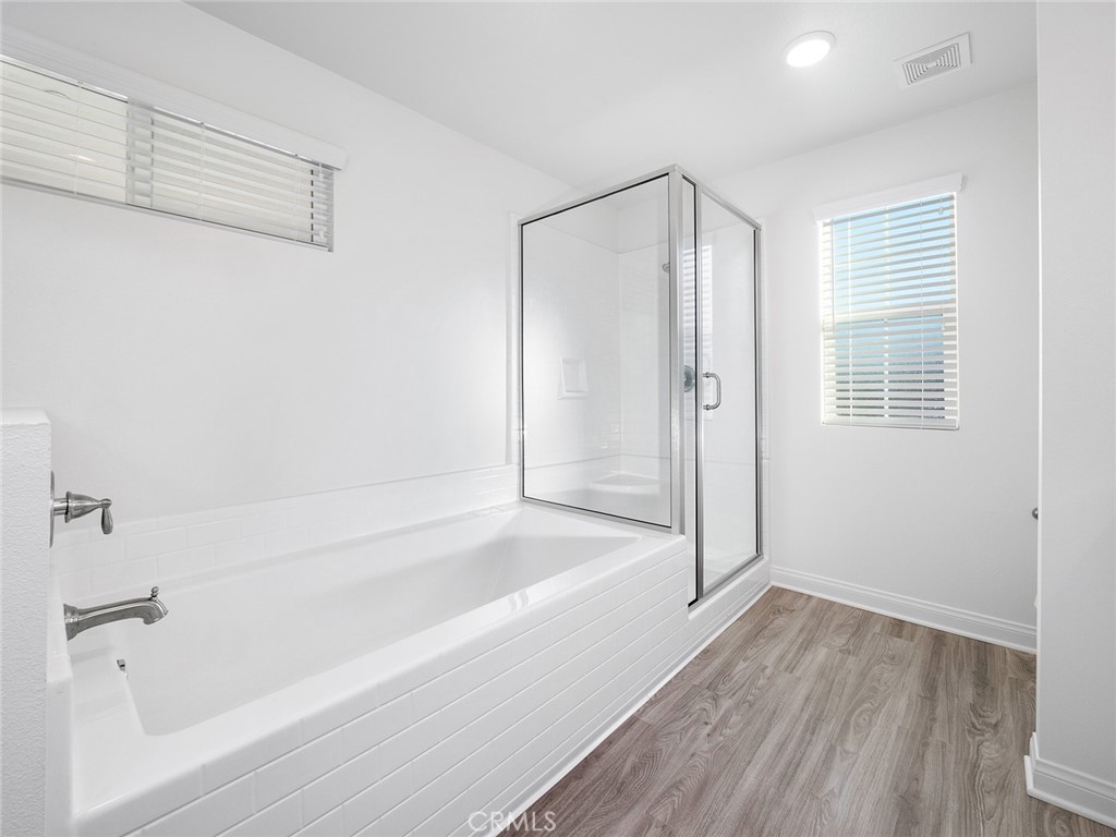 1325 West Grand Avenue, Unit 3 Pomona, CA 91766 - Photo 20 of 30 a bathroom with a bathtub and a shower