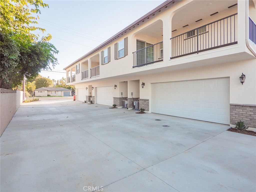 1325 West Grand Avenue, Unit 3 Pomona, CA 91766 - Photo 2 of 30 a view of back yard of the house