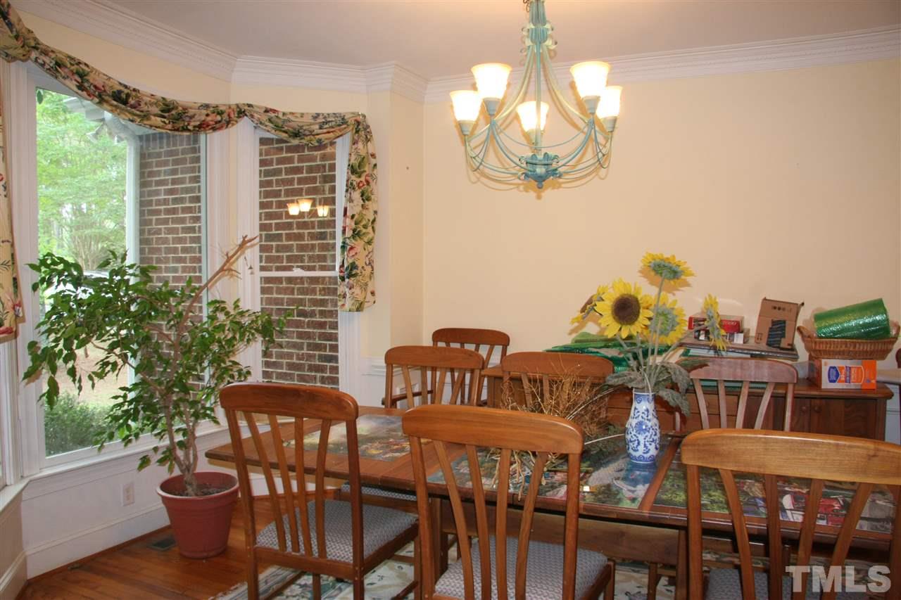 232 Release Circle Raleigh, NC 27615 - Photo 2 of 23 a view of a dining room with furniture window and wooden floor