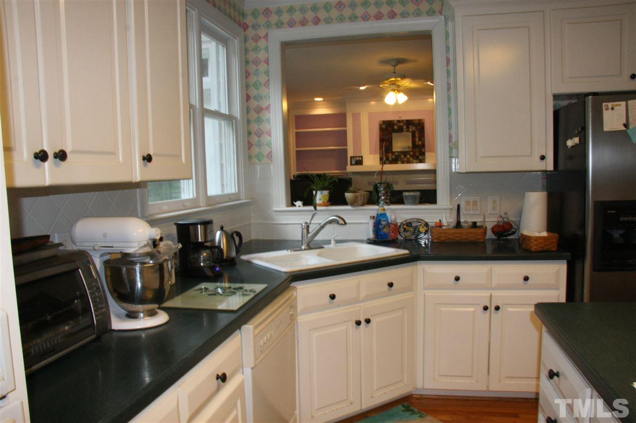 232 Release Circle Raleigh, NC 27615 - Photo 14 of 23 a kitchen with cabinets and appliances