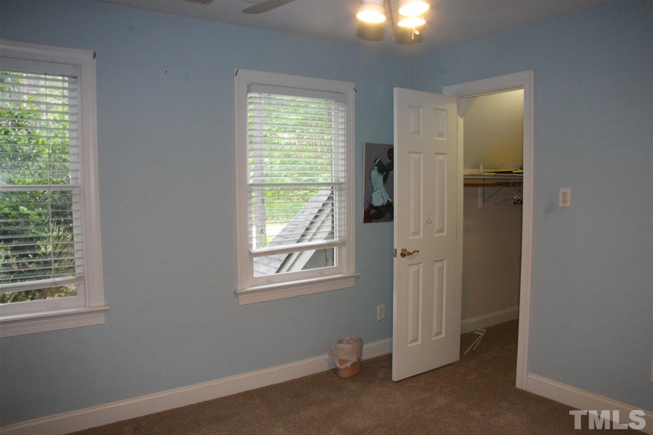 232 Release Circle Raleigh, NC 27615 - Photo 16 of 23 an empty room with windows and closet