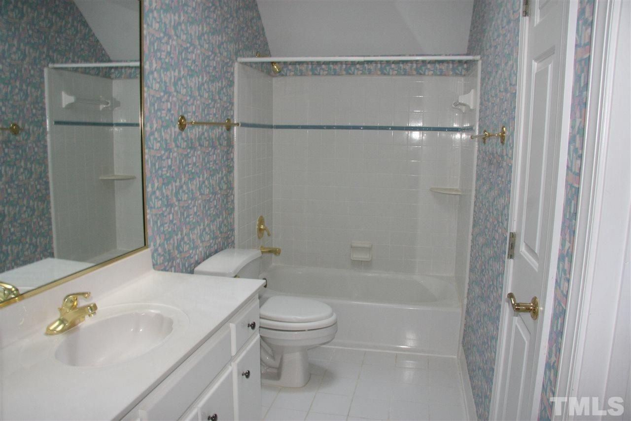 232 Release Circle Raleigh, NC 27615 - Photo 20 of 23 a bathroom with a sink toilet and shower