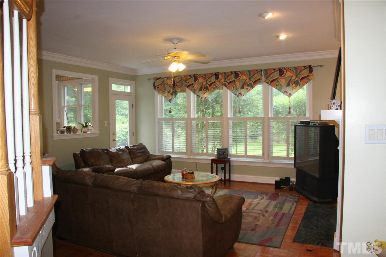 232 Release Circle Raleigh, NC 27615 - Photo 5 of 23 a living room with furniture and a large window