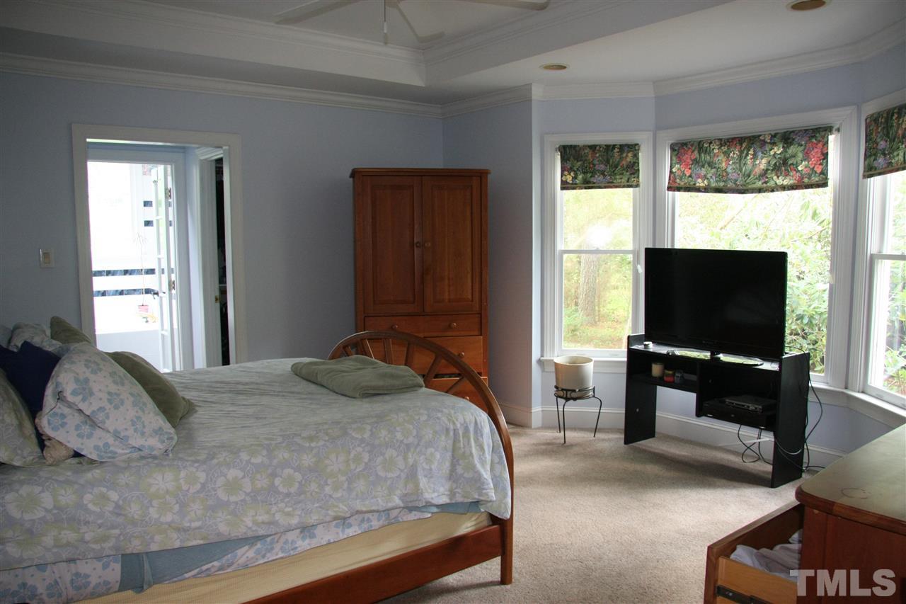 232 Release Circle Raleigh, NC 27615 - Photo 6 of 23 a bedroom with a bed and a television