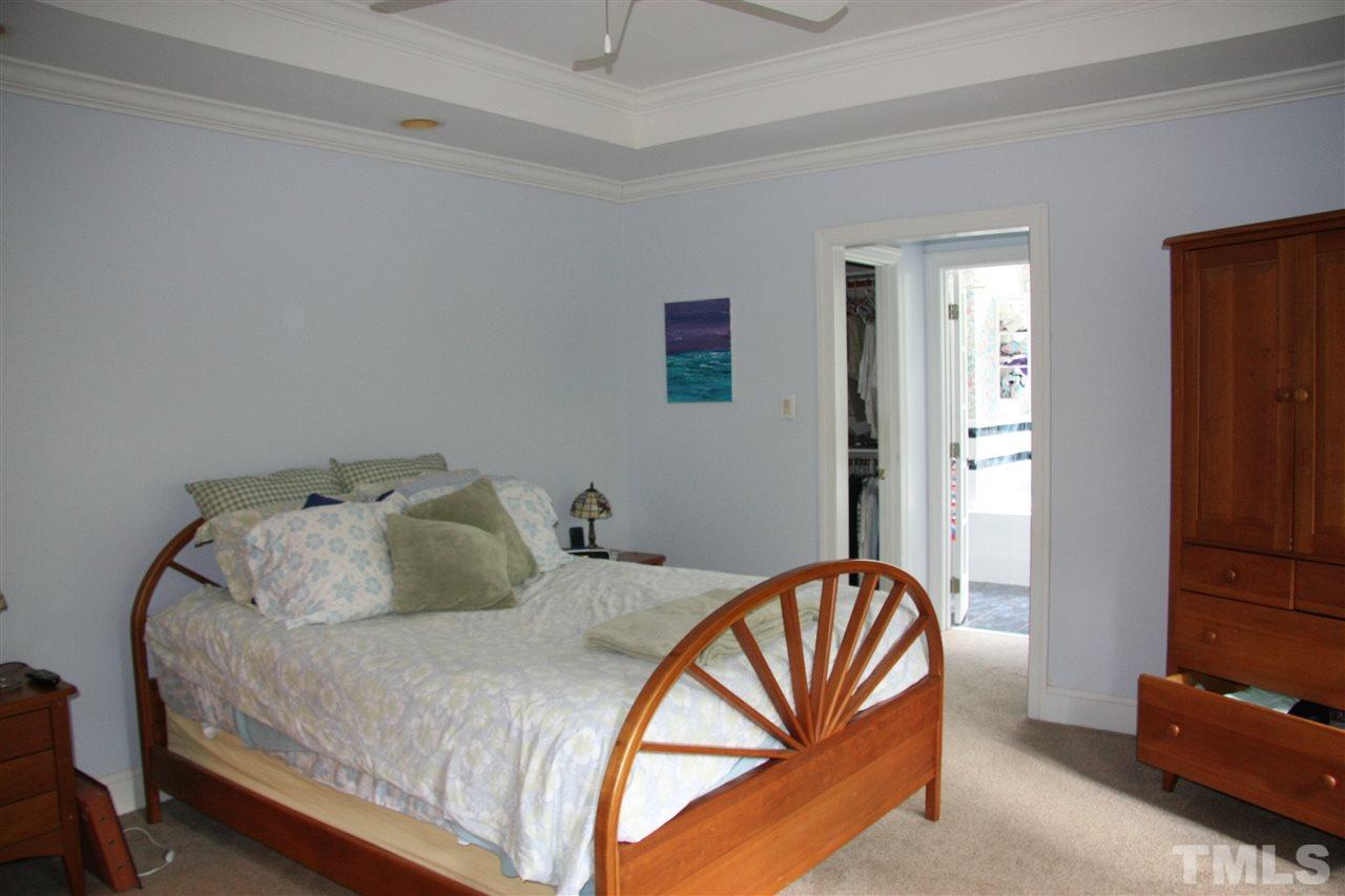 232 Release Circle Raleigh, NC 27615 - Photo 7 of 23 a bedroom with a bed and a couch