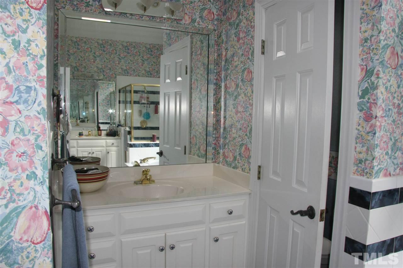 232 Release Circle Raleigh, NC 27615 - Photo 10 of 23 a bathroom with a sink and a mirror