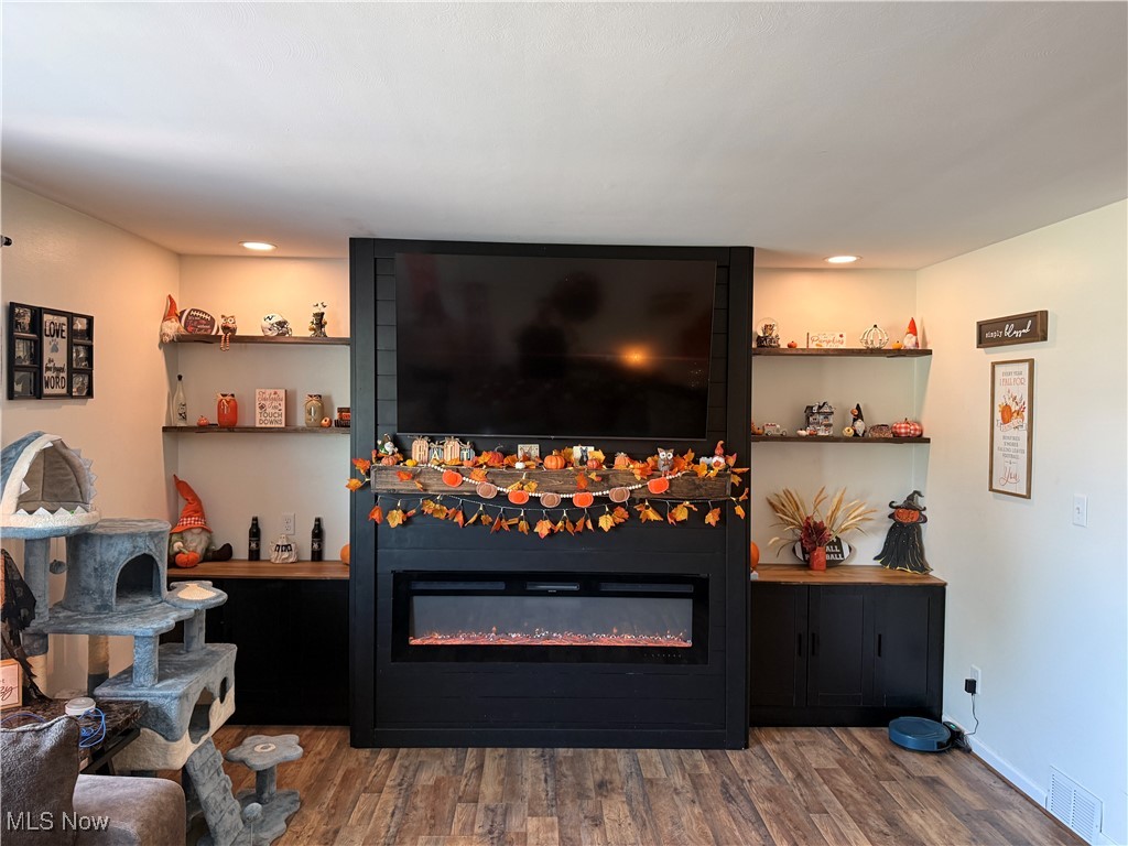 914 Pinecrest Road Girard, OH 44420 - Photo 6 of 24 Living area with wood finished floors, a fireplace, and recessed lighting