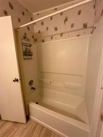 a bathroom with a sink mirror toilet and shower