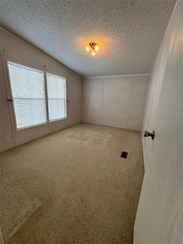 an empty room with a bathroom