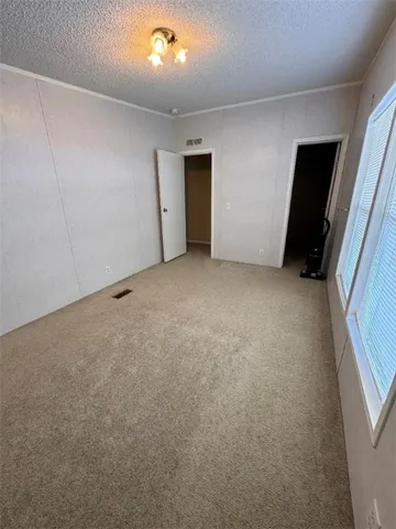 a kitchen with a stove and cabinets
