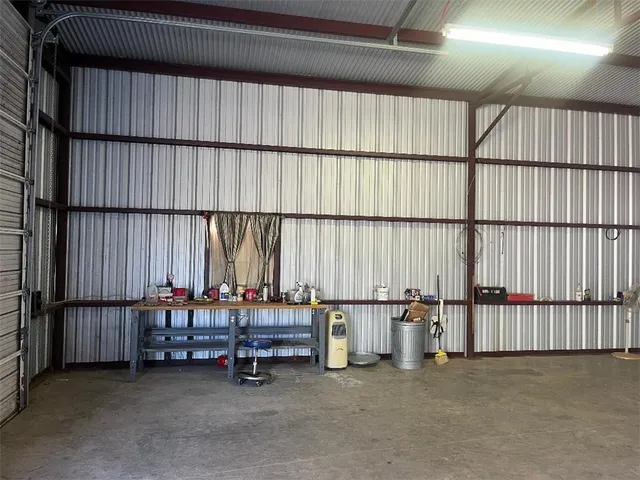 a view of a livingroom with furniture and white walls