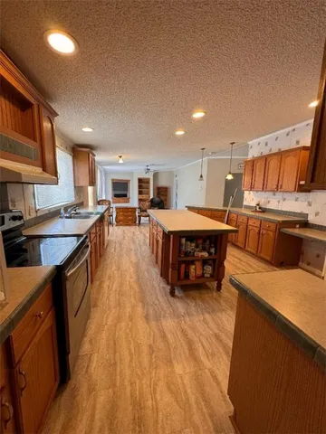 a kitchen with stainless steel appliances lots of counter top space