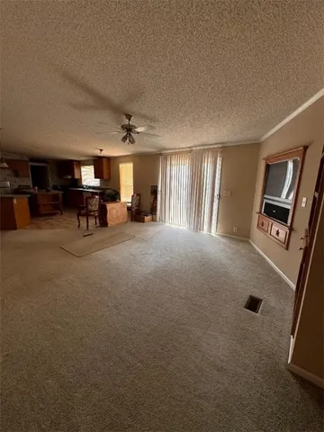 a living room with furniture and a chair