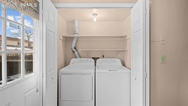 a utility room with dryer and washer