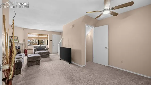 a view of a livingroom with furniture and a flat screen tv