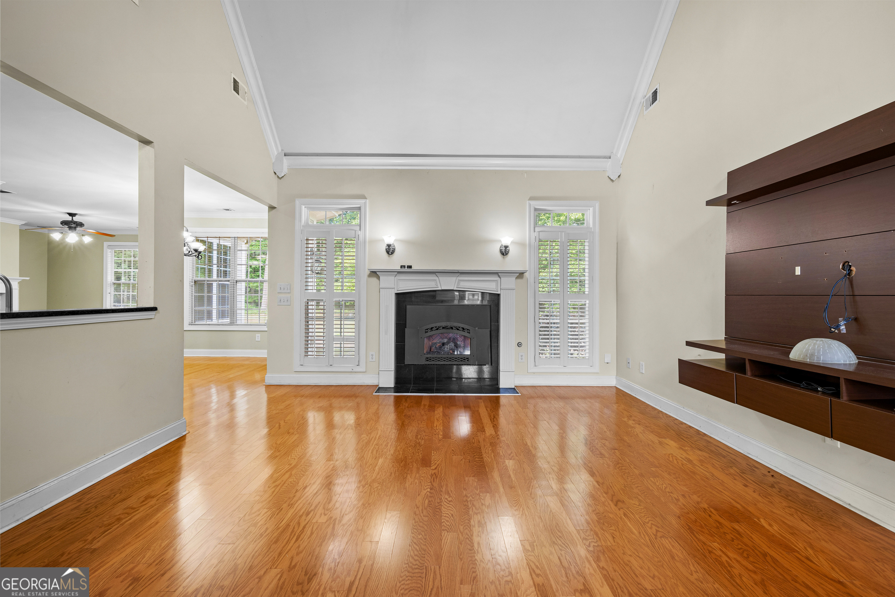 120 Shankhill Ridge Tyrone, GA 30290 - Photo 9 of 54 a view of a room with wooden floor and a fireplace