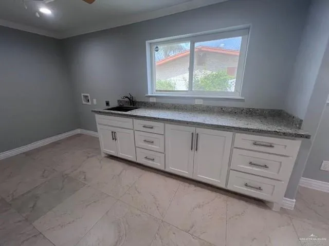 a room with window double vanity and mirror