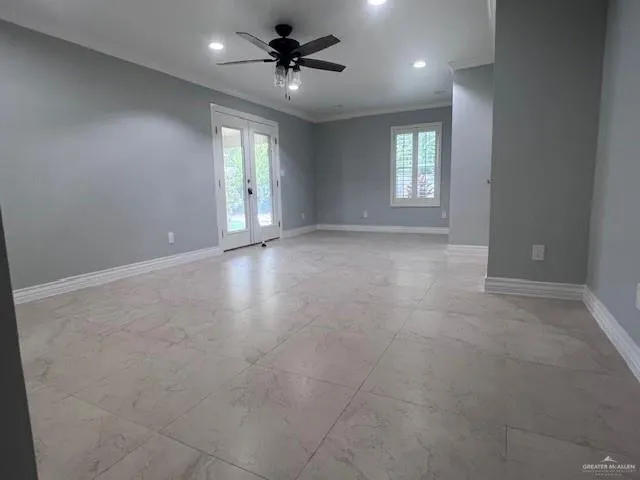 a view of an empty room with a window