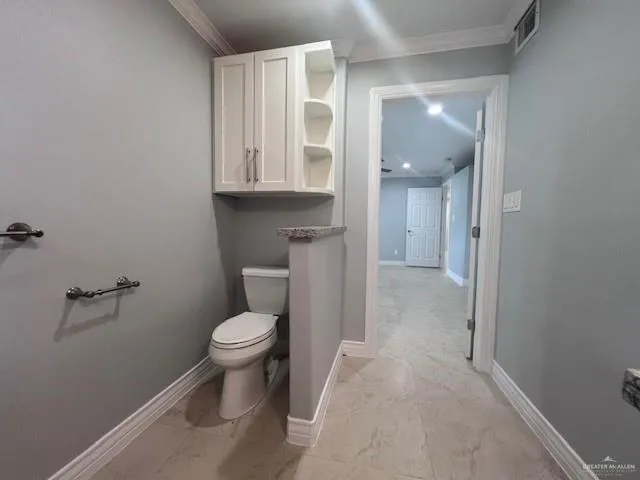 a view of room with wooden floor