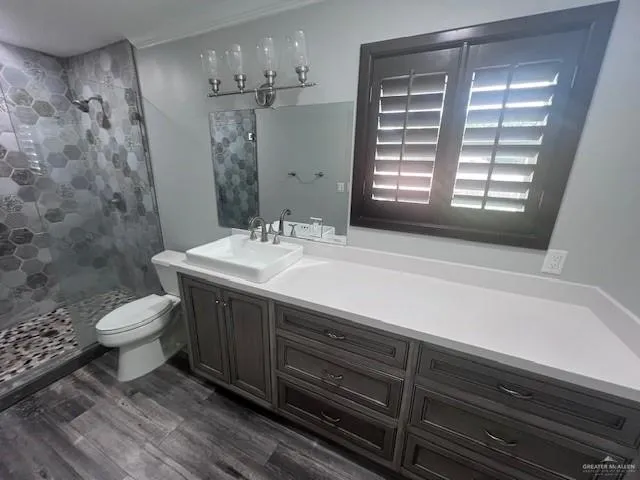 a bathroom with a sink a large mirror and vanity