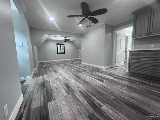 an empty room with wooden floor