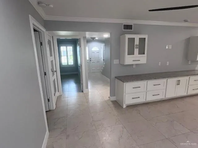 a view of a hallway with front door