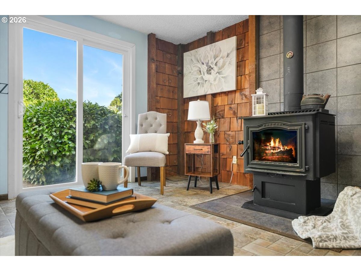 2035 Primrose Loop Philomath, OR 97370 - Photo 32 of 48 a living room with furniture and a fireplace
