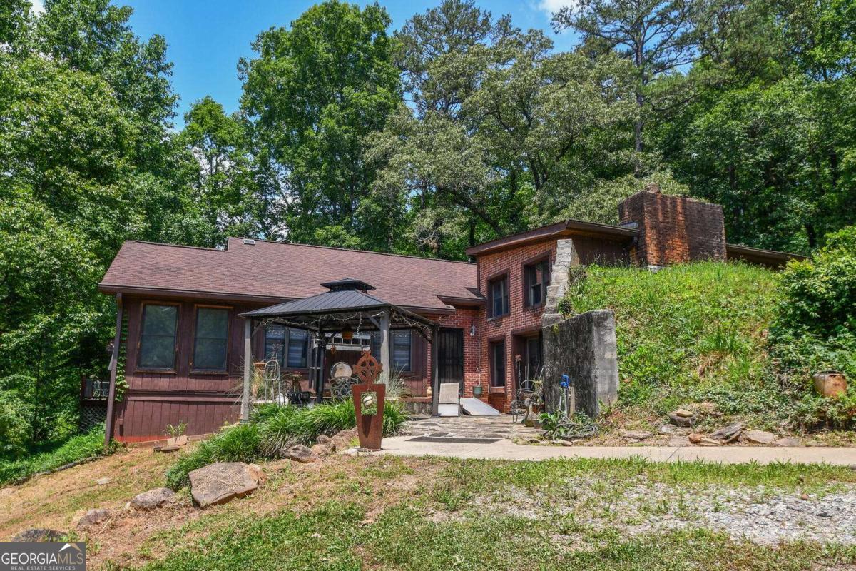 501 The Orchard Road Clarkesville, GA 30523 - Photo 5 of 20 a front view of a house with garden