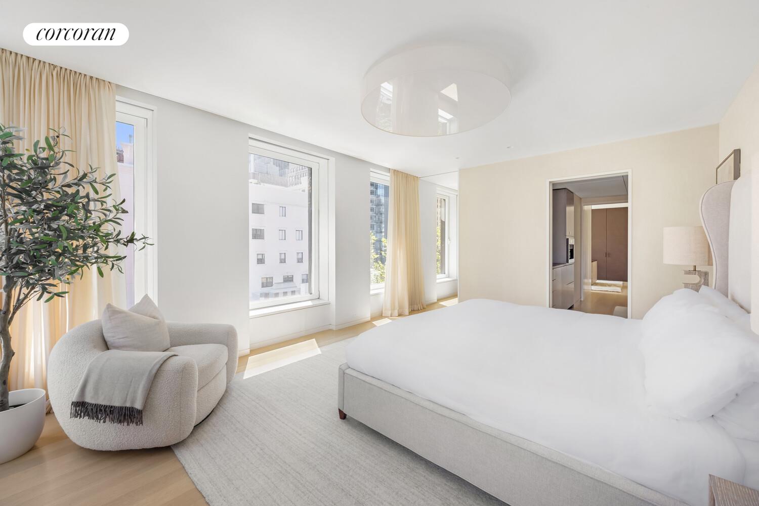 37 Warren Street, Unit PHCD Manhattan, NY 10007 - Photo 10 of 23 a spacious bedroom with a bed and a couch