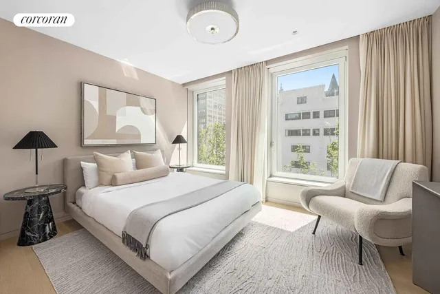 a bathroom with a double vanity sink and mirror