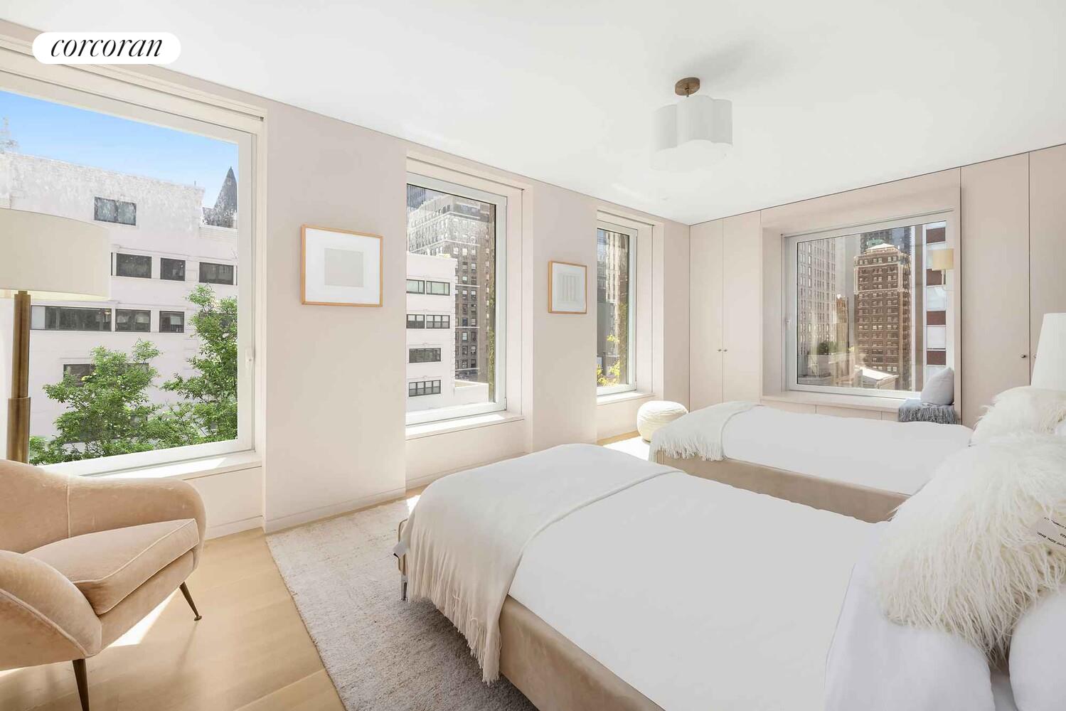 37 Warren Street, Unit PHCD Manhattan, NY 10007 - Photo 16 of 23 a bedroom with a large window with a bed