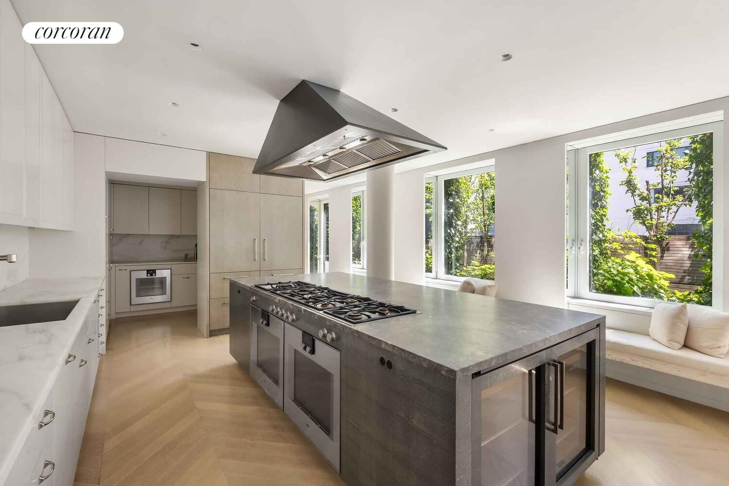 37 Warren Street, Unit PHCD Manhattan, NY 10007 - Photo 4 of 23 a kitchen with stainless steel appliances granite countertop a stove and a sink