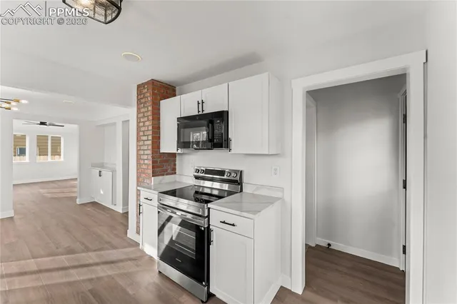 a kitchen with a stove and a microwave