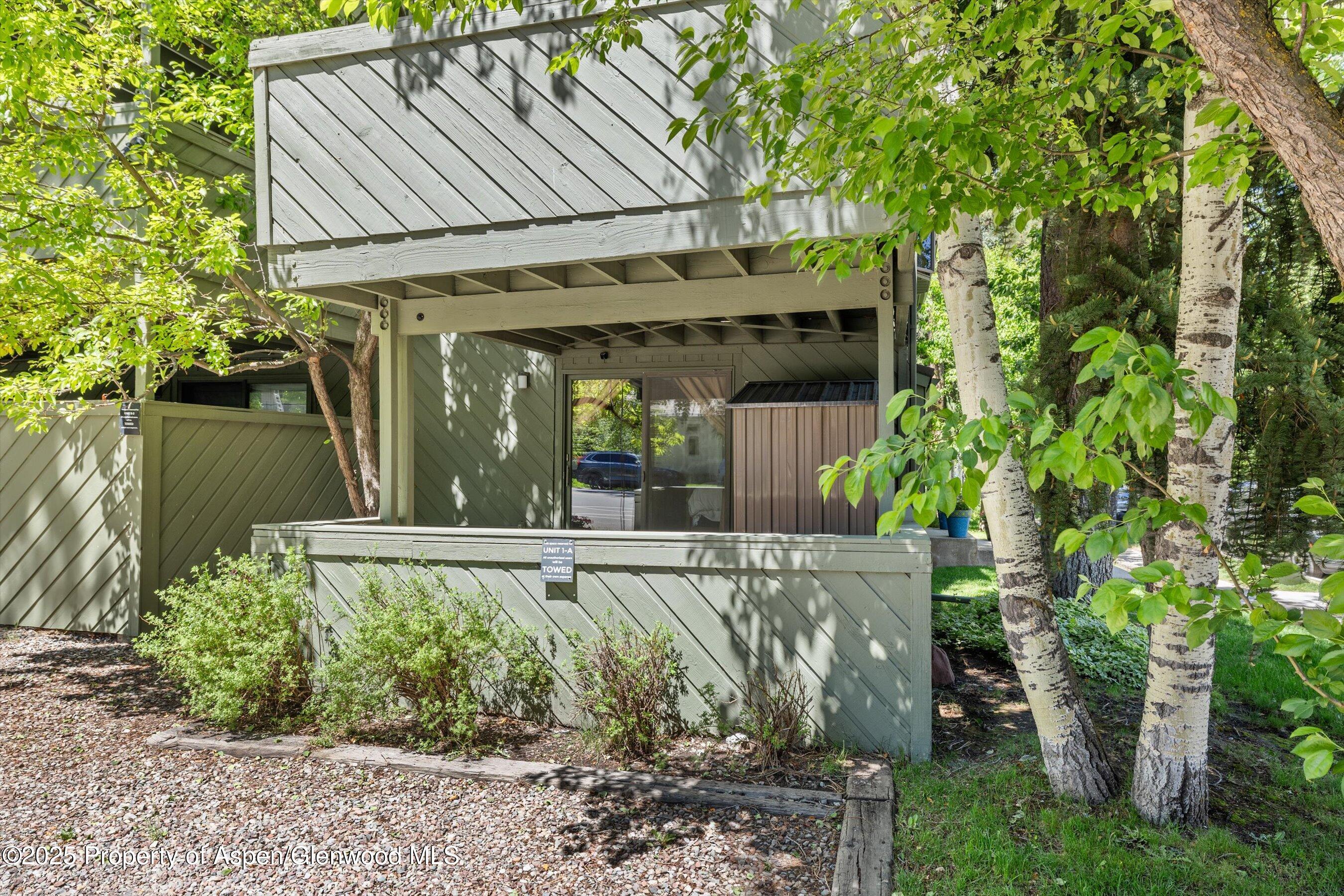 125 East Hyman Avenue, Unit 1A Aspen, CO 81611 - Photo 13 of 19 front view of a house with a tree