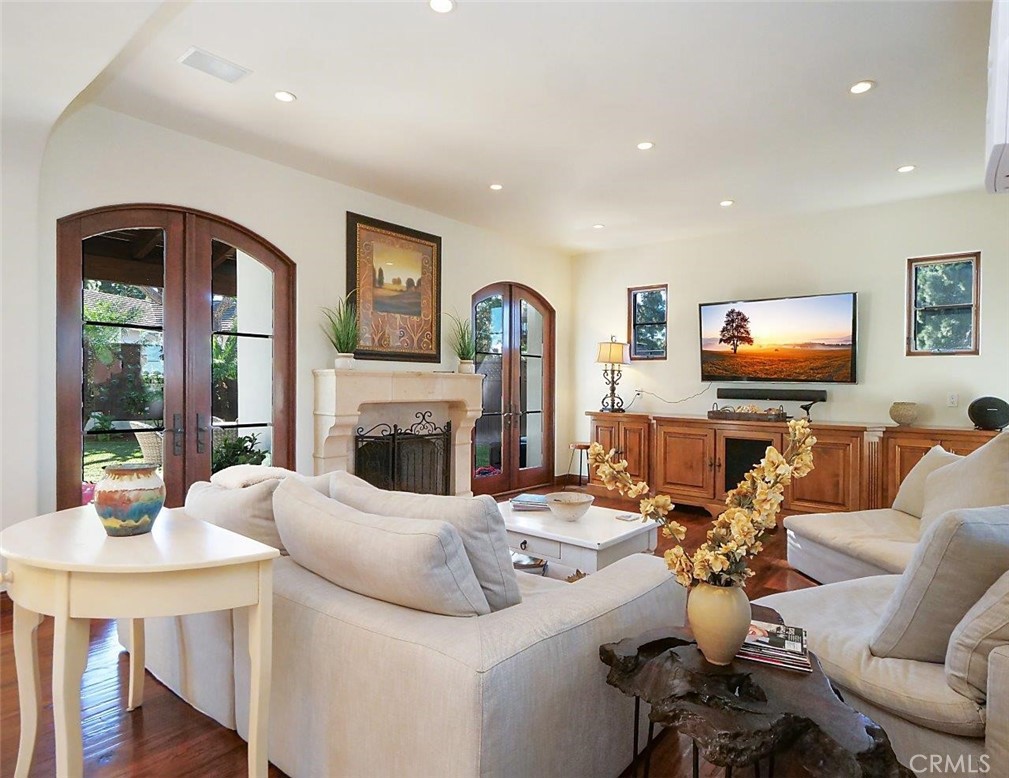 1724 Vía Estudillo Palos Verdes Estates, CA 90274 - Photo 11 of 45 a living room with furniture a fireplace and a flat screen tv