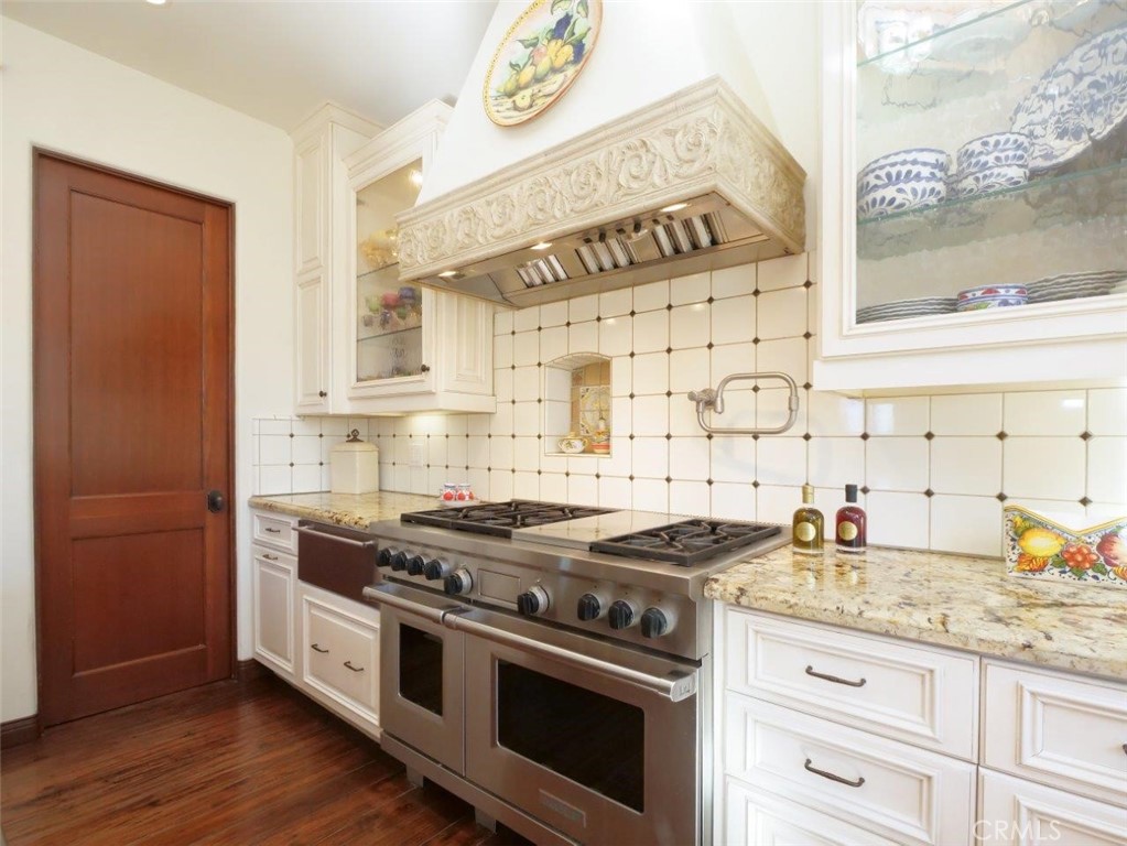 1724 Vía Estudillo Palos Verdes Estates, CA 90274 - Photo 19 of 45 a kitchen with stainless steel appliances granite countertop a stove and a sink