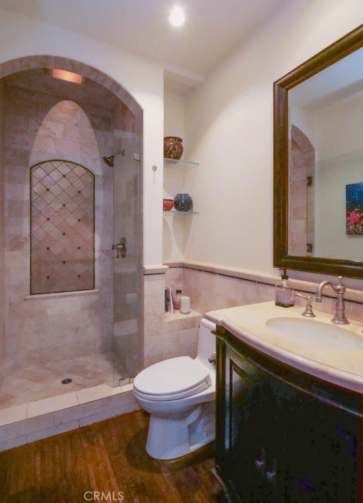 1724 Vía Estudillo Palos Verdes Estates, CA 90274 - Photo 22 of 45 a bathroom with a toilet a sink and mirror
