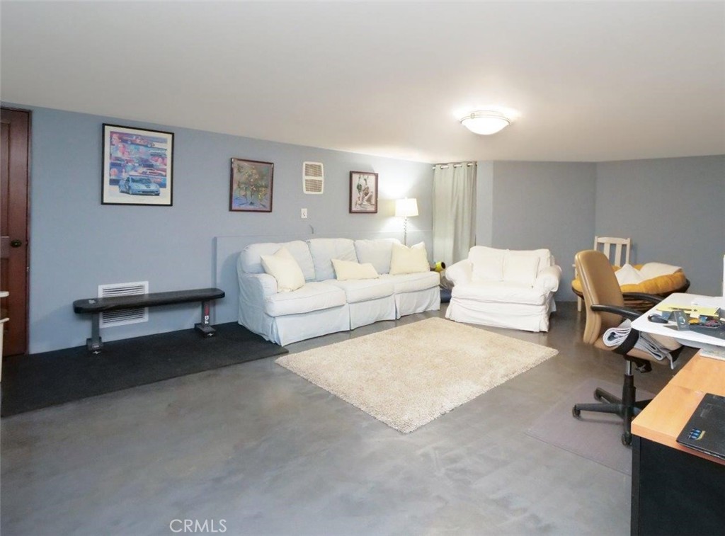 1724 Vía Estudillo Palos Verdes Estates, CA 90274 - Photo 41 of 45 a living room with furniture and a lamp