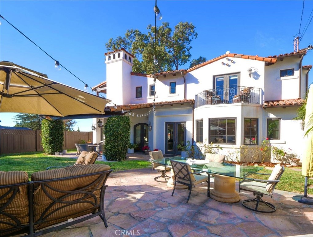 1724 Vía Estudillo Palos Verdes Estates, CA 90274 - Photo 43 of 45 a front view of a house with a yard glass top table and chairs