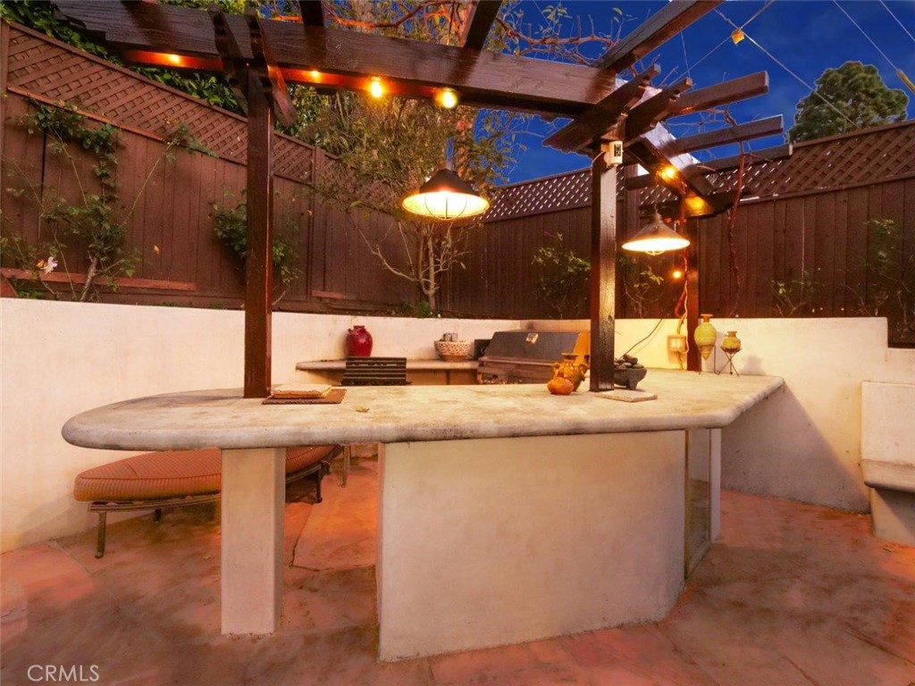 1724 Vía Estudillo Palos Verdes Estates, CA 90274 - Photo 5 of 45 a kitchen with a sink a counter and chairs