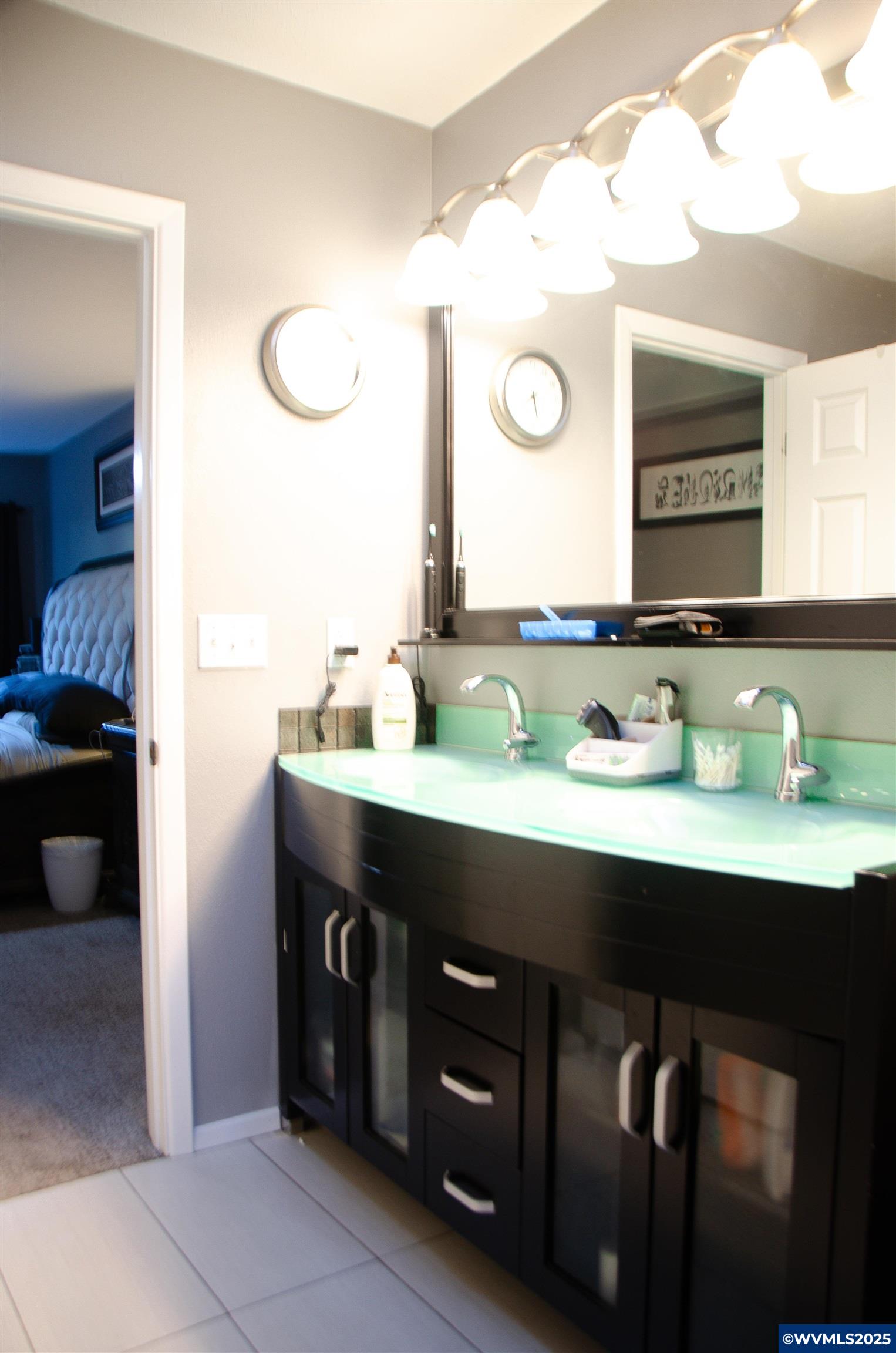 16870 Selden Road Dallas, OR 97338 - Photo 15 of 42 a bathroom with a double vanity sink and a mirror