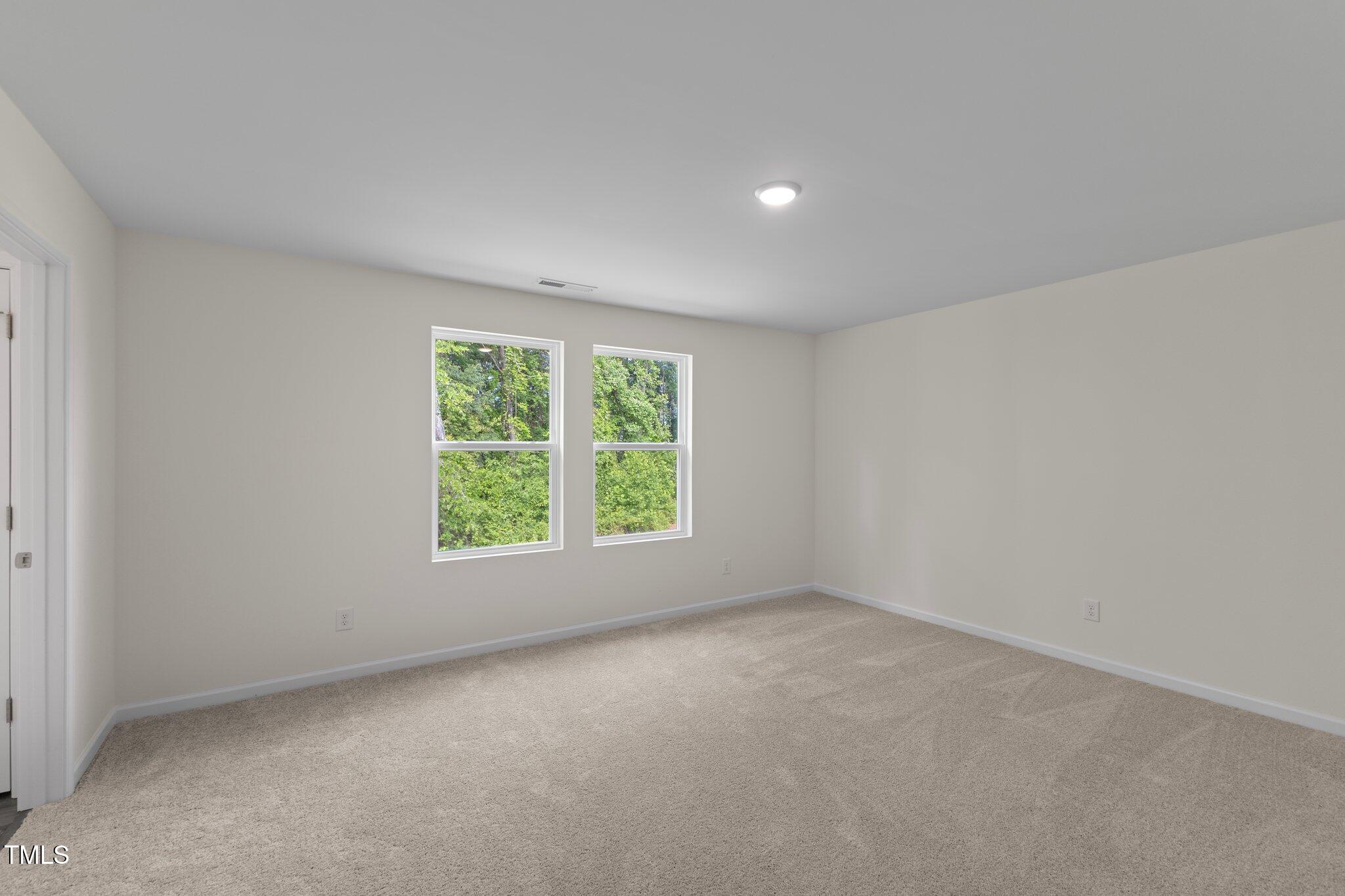 1200 Solace Way Rolesville, NC 27571 - Photo 9 of 24 an empty room with windows