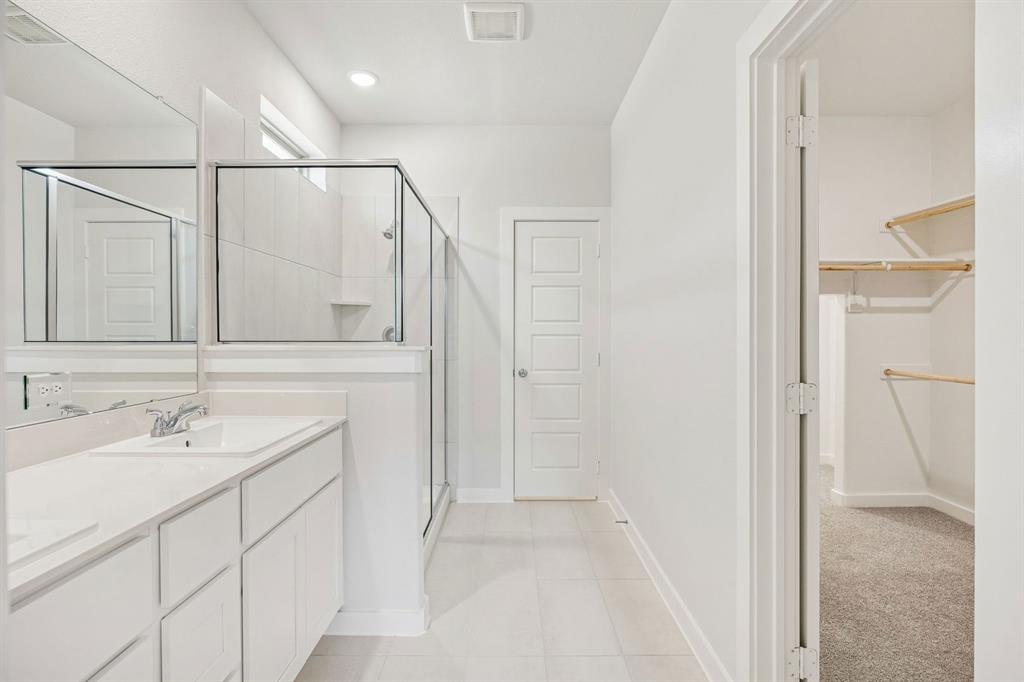 5719 Rushing River Way McKinney, TX 75071 - Photo 26 of 40 Primary Bathroom in the Stanley II home plan by Trophy Signature Homes – REPRESENTATIVE PHOTO