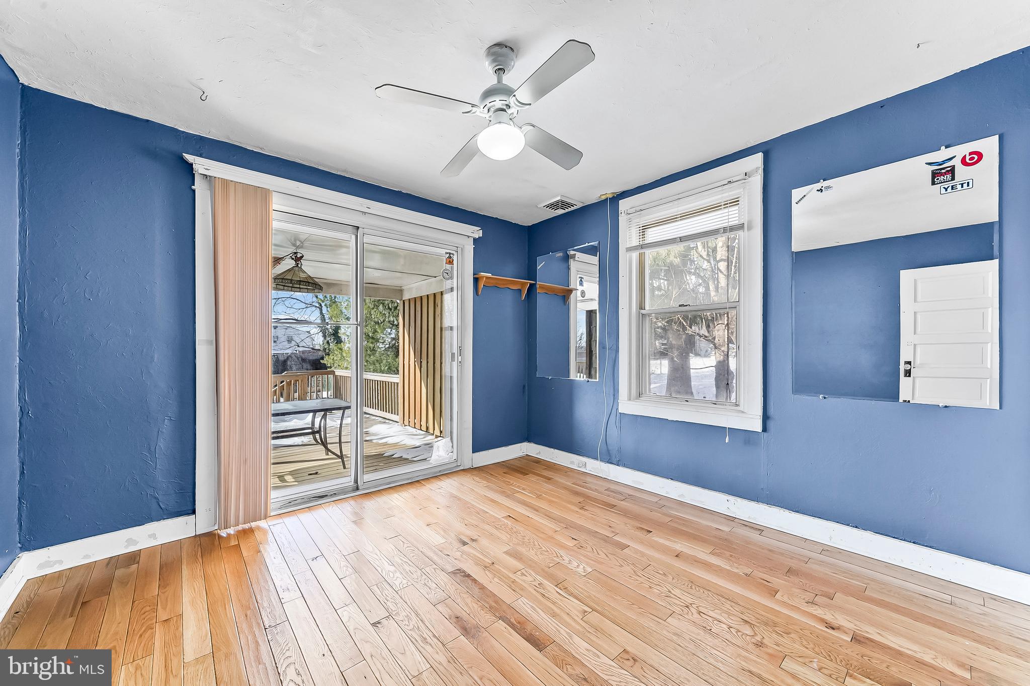 22 Partridge Avenue Ridley Park, PA 19078 - Photo 13 of 32 FIRST FLOOR BEDROOM W/SLIDERS TO DECK