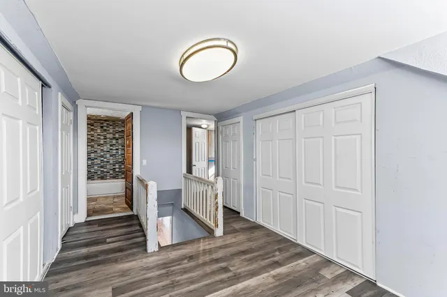 a view of entryway with wooden floor