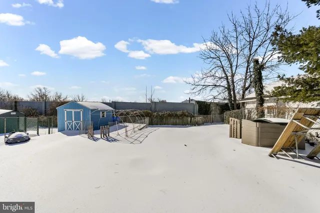 a view of a covered with snow in front of house