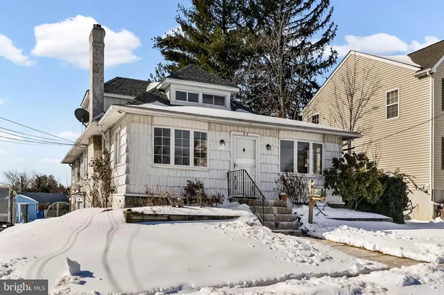 a view of a house with outdoor seating