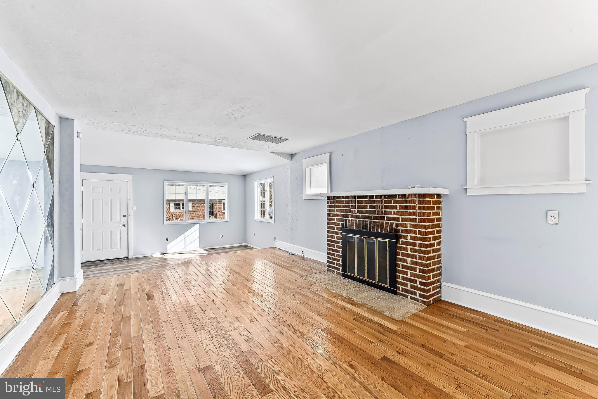 22 Partridge Avenue Ridley Park, PA 19078 - Photo 5 of 32 LIVING ROOM W/WOOD BURNING FIREPLACE