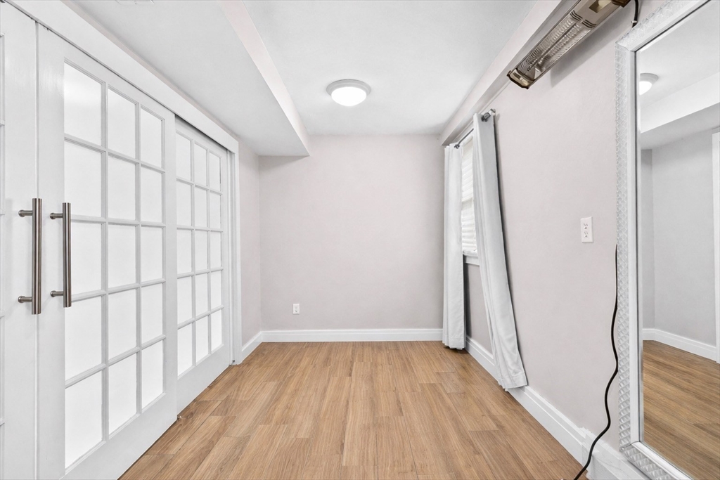 137 Westboro Road Grafton, MA 01536 - Photo 25 of 28 wooden floor in an empty room with a window